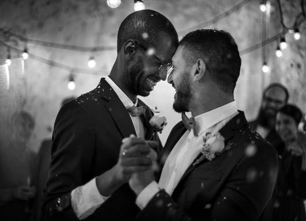 photodune-KERAg6QD-newlywed-gay-couple-dancing-on-wedding-celebration-photodune-main-file.jpeg